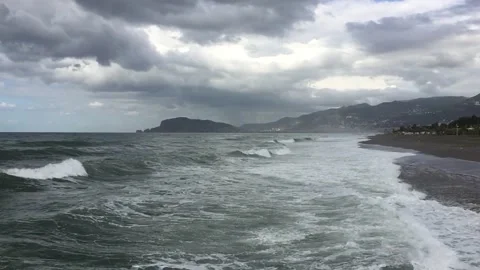 Sea big waves. Mountains on background. Stock Footage 98299205