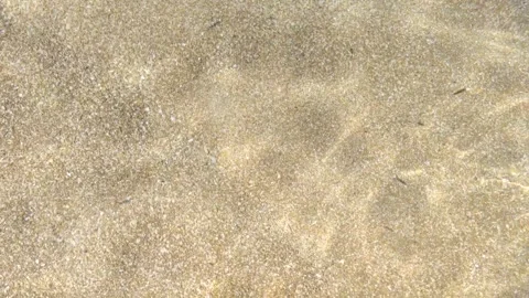 Sea bottom texture, yellow sand waves in shallow water. Stock Footage 154524764
