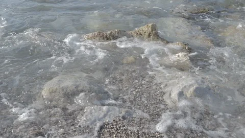 Sea breaks on the rocks with log profile Stock Footage 123356541