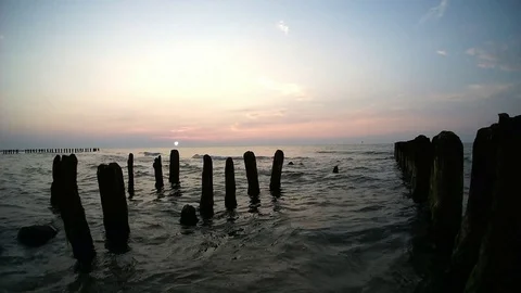 Sea breakwater while sunset Stock Footage 121683031