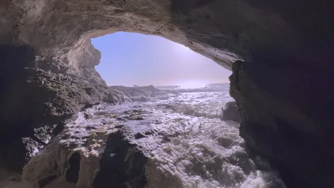 Sea Cave with Crashing Waves in Reverse Stock Footage 234344767