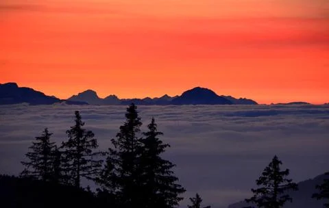 Sea of Clouds Below Mountains at Sunset Stock Photos