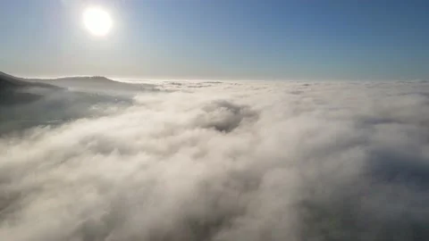 Sea of clouds below mountaintop Stock Footage 233428434