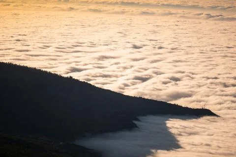 Sea of clouds below the summit of Teide volcano in Tenerife Stock Photos