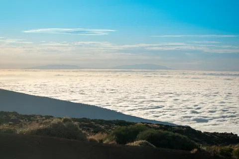 Sea of clouds below the summit of Teide volcano in Tenerife Stock Photos