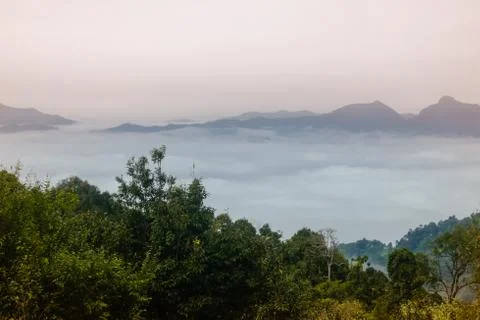 Sea of clouds at the dawn with a view of mountain range. Nan province, Thailand. Stock Photos