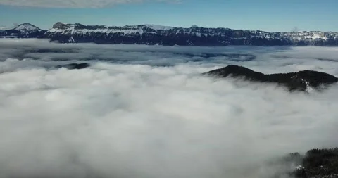 A sea of clouds with distant mountain ranges in Alpes-Belledonne, France Stock Footage 301373401
