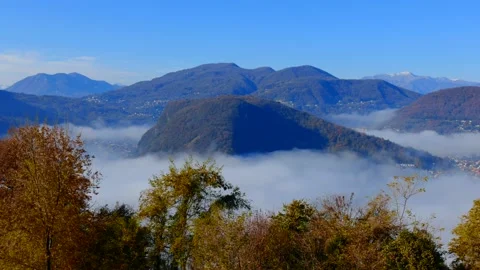 Sea of Clouds over Alpine Lake Lugano with Mountain View in a Sunny Day Stockbeeldmateriaal 165596861