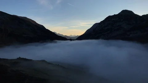 Sea of clouds over mountain lake at dawn Stock Footage 95301258