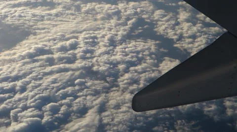 A sea of clouds seen from an airplane window Stock Footage 37814035