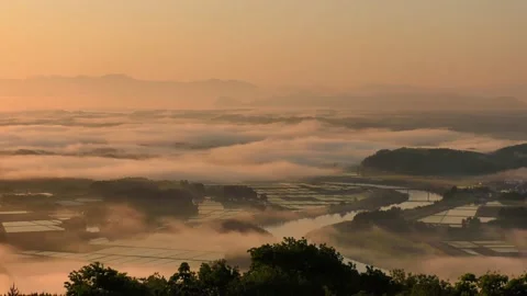 Sea of clouds shining in orange Video stock 144820642