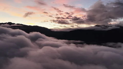 Sea of clouds at sunrise over mountain silhouettes in China, aerial Stock Footage 341848280