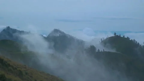 Sea of clouds at sunset over the mountains of Lombok, in Indonesia Stock Footage 221859154