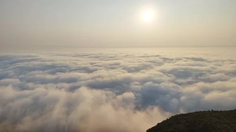 Sea of Clouds Under Pale Sun at High Altitude Mountain Timelapse Stock Footage 333499838