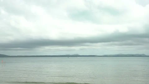 Sea on a cloudy day after raining with speed boat drives fast on the sea. Stock Footage 193985937