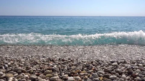 Sea, coast, pebble beach, wave hits the shore. Stock Footage 121057553