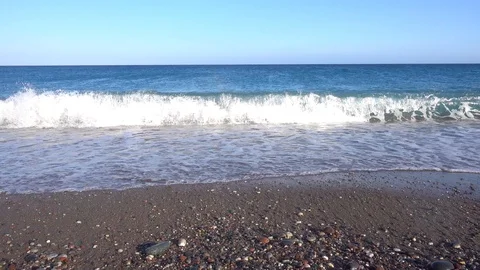 Sea, coast, pebble beach, wave hits the shore. Stock Footage 121105281