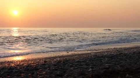Sea coast at sunset. Reflection of the sun in the sea. Stock Footage 120653048