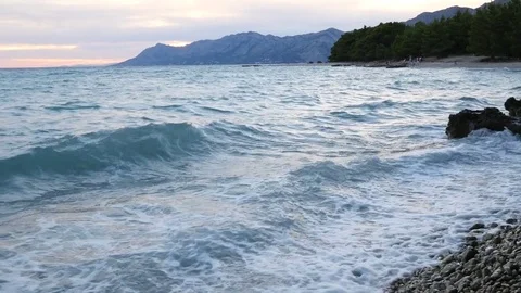 Sea coast with waves during sunset Stock Footage 78910325