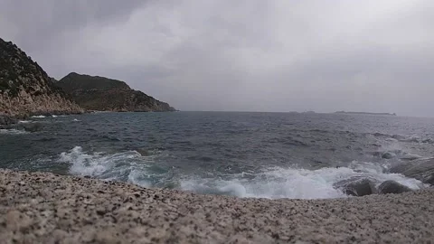 Sea during bad weather, wind and waves crashing on the rocks Stock Footage 158041933