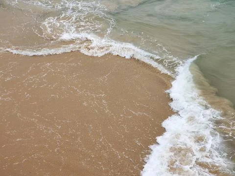 Sea ​​element collision of two waves rising sea sand Stock Photos