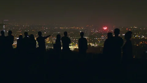 A sea of fireworks explode throughout the city of Los Angeles Stock Footage 119285567