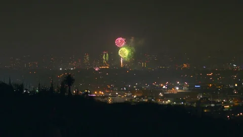 A sea of fireworks explode throughout the city of Los Angeles Stock Footage 119290920