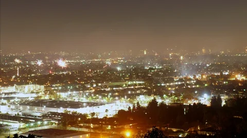 A sea of fireworks explode throughout the city of Los Angeles Stock Footage 119292824