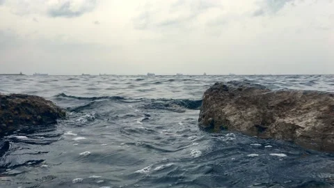 Sea fluctuating between rocks Stock Footage 133742065