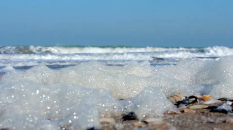 Sea foam on the seashore 動画素材 59606262