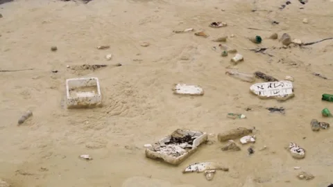 Sea Foam with trash Stock Footage 143645473
