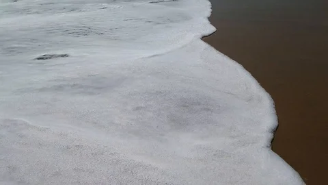 Sea foam washes sand. Close-up. Stock Footage 124448954