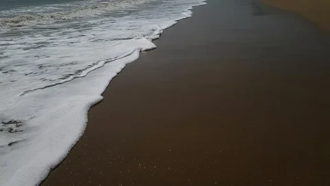 Sea foam washes sand. Close-up. Stock Footage 124513394