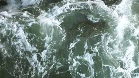 Sea foam in waves Stock Footage 8660424