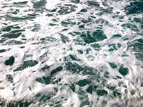 Sea with foam waves. Stock Photos