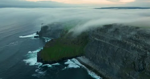 Sea fog cascading over Cliffs of Moher at sunrise, County Clare, Ireland Stock Footage 339508070
