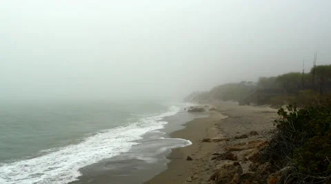 Sea fog overwhelmes an empty beach, 4K Stock Footage 47336816