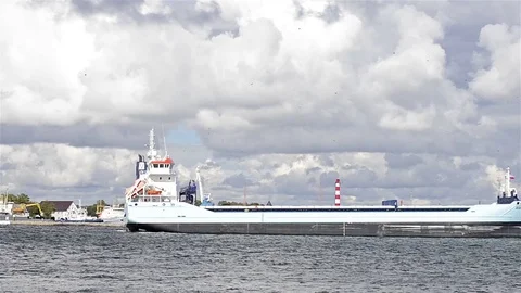 Sea freight barge sailing in Baltic port Stock Footage 73054145