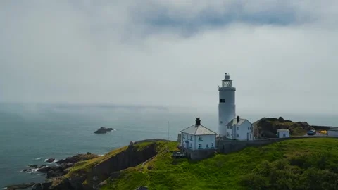 Sea Fret over Start Point Lighthouse, Trinity House and South West Coast Path Stock Footage 243572856