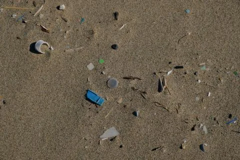 Sea garbage plastic pollution composition on winter sandy beach Stock Photos