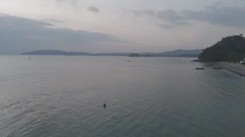 Sea, hills in the far background Stock Footage 303055038
