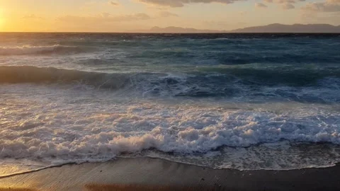 Sea horizon, wave at sunset hitting the beach. Stock Footage 199037865