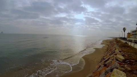 Sea illuminated by a ray of light on a cloudy day Video stock 103573379