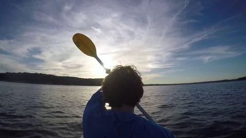 Sea kayaking at sunset Stock Footage 82396046