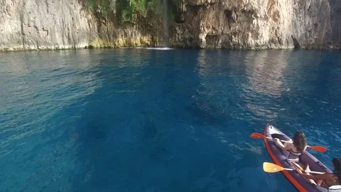 Sea Kayaking with waterfall aerial view 스톡 동영상 74759028
