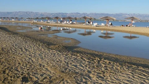 Sea Lagoon Beach With Distant Mountains (1) Stock Footage 98673242