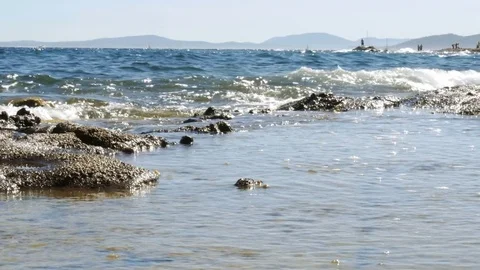 Sea landscape with rocks on a bright summer day - 4k Stock Footage 80424373