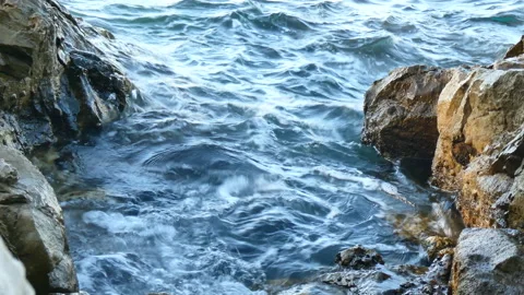 Sea lapping at rocks Stock Footage 148791425