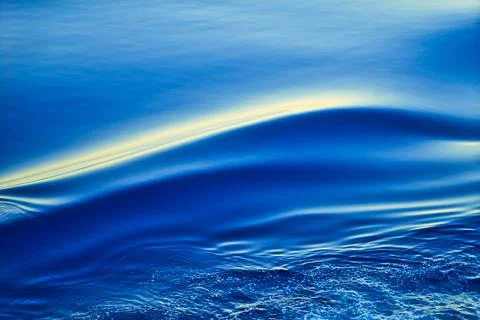 The sea level moves smoothly to create layers of ripples. Stock Photos