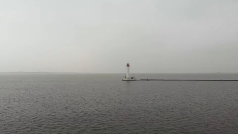 Sea lighthouse in cloudy weather Видео 105672920